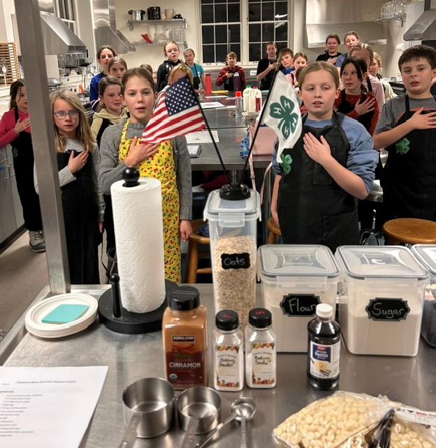Youth reciting the 4-H Pledge before a project meeting